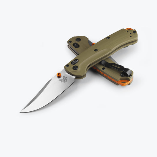Benchmade 15534 Mini Taggedout folding hunting knife with OD green G10 handle and orange anodized accents — ClassicBlades
