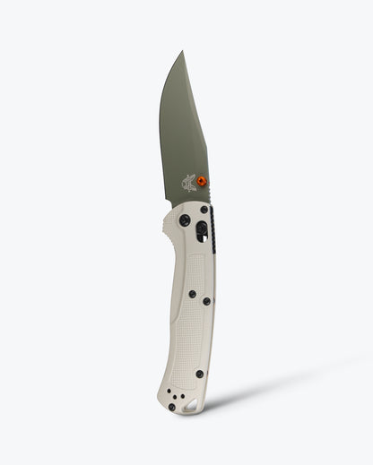 Benchmade 15536GN-01 Taggedout tan Grivory handle with orange anodized thumb stud, barrel spacers and black oxide hardware — ClassicBlades