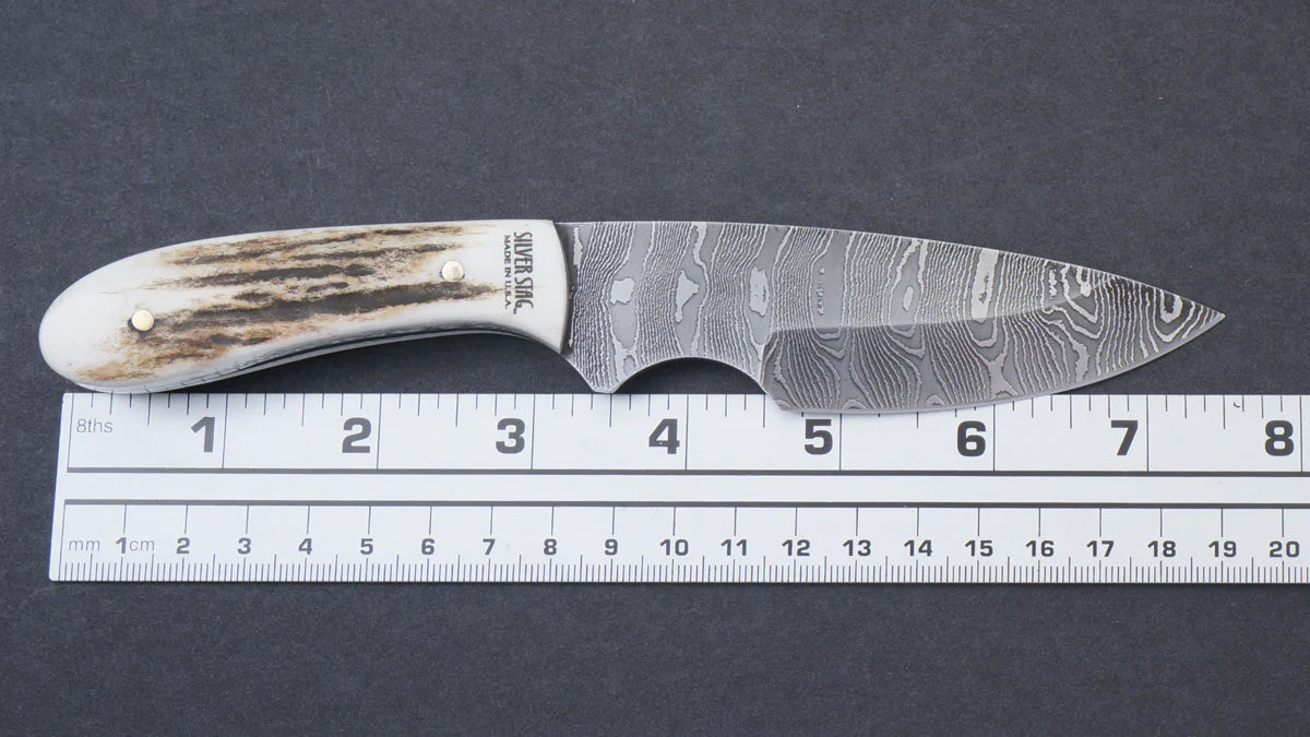 Silver Stag DFS3.1 Field Slab 3.1 inch hand forged Damascus drop point blade showing unique layered pattern detail — ClassicBlades