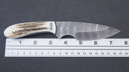 Silver Stag DFS3.1 Field Slab 3.1 inch hand forged Damascus drop point blade showing unique layered pattern detail — ClassicBlades