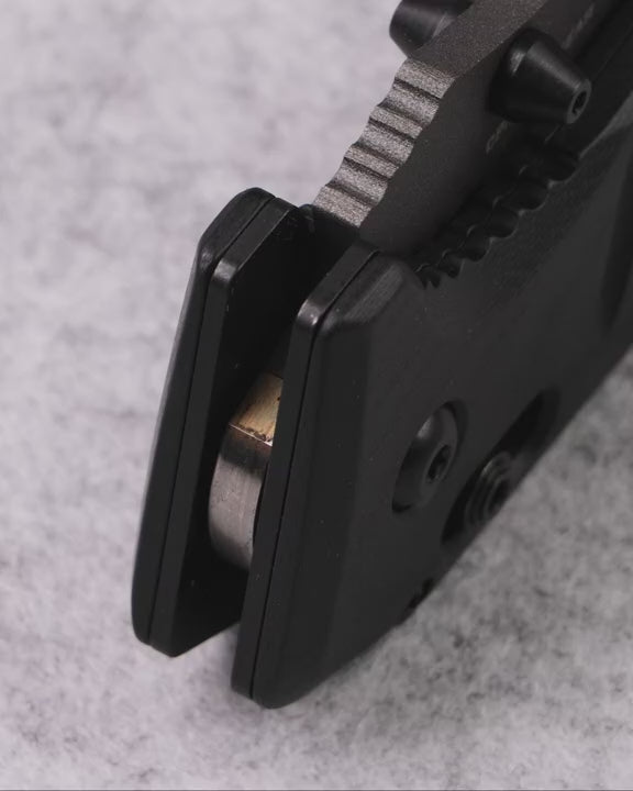 Black G10 handle folding knife designed for survival, camping, and outdoor adventures